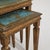 A set of three Italian Florentine nesting tables dating to circa 1960, designed with stacked proportions allowing each...