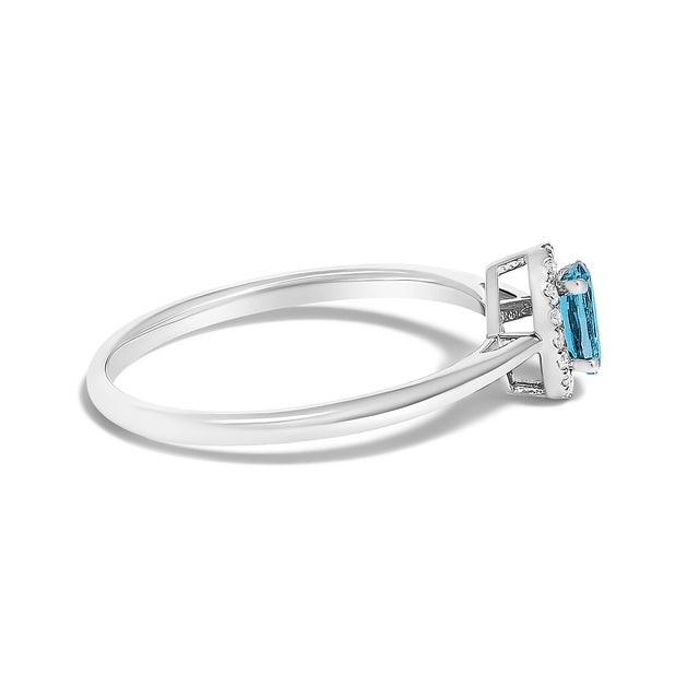 Contemporary 10K White Gold 5X3MM Oval Blue Topaz and Diamond Accent Halo Ring (I-J Color, I1-I2 Clarity) - Ring Size 5 For Sale - Image 3 of 7