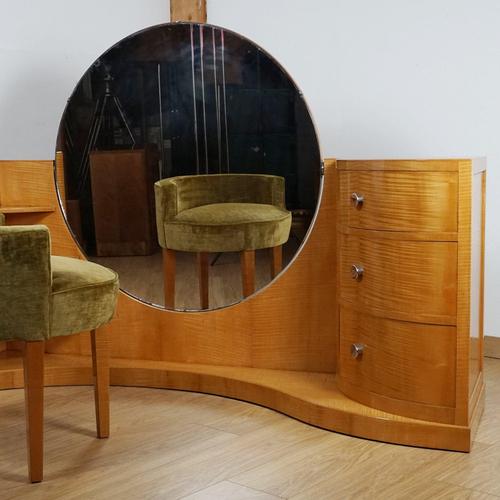 An art deco dressing table and stool by betty joel. Satinwood veneer with three curved drawers to the right hand side with...