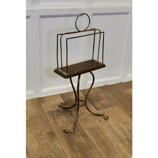 Stylish Victorian Golden Oak and Brass Revolving Magazine Rack This is a attractive brass magazine rack it is set onto an...
