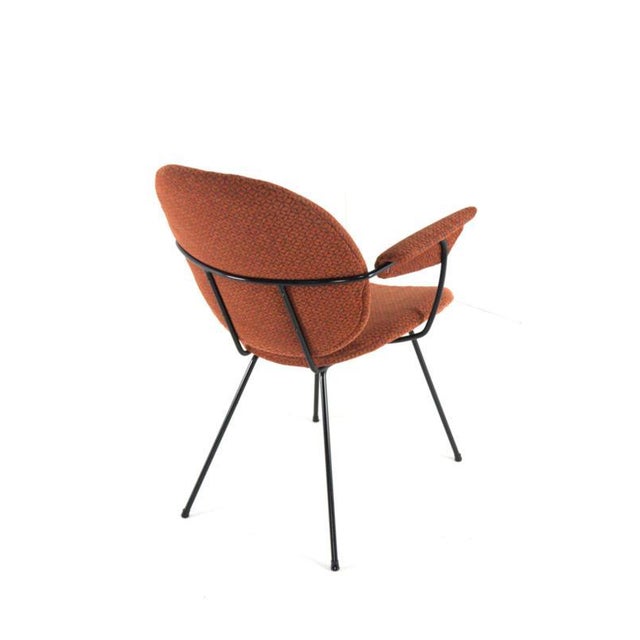This elegant Kembo armchair is a beautiful example of Dutch mid-century design: compact, playful, and extremely...