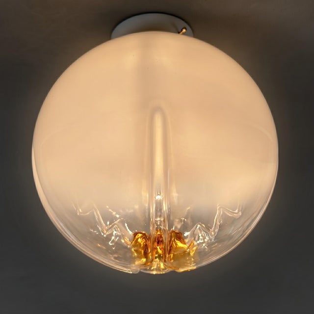 A luminous icon with futuristic allure and exceptional rarity. This exquisite ceiling light represents a superb example of...