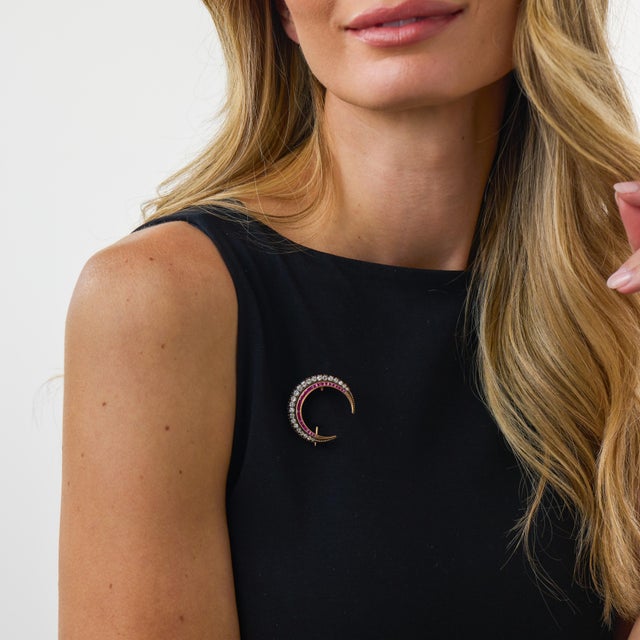 This exceptional Victorian crescent brooch is a dramatic antique jewel from the 1890’s, set with 23 old European cut...
