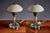 Elegant pair of Italian Mid-Century Modern table lamps, featuring off-white domed metal shades, patinated brass supports,...