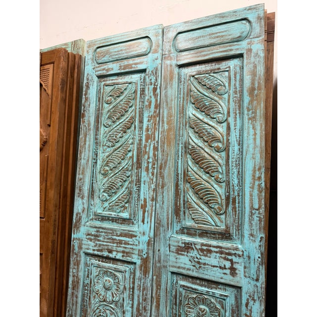 Add character and vintage charm to your home with these beautifully hand-carved blue floral closet doors, crafted from...