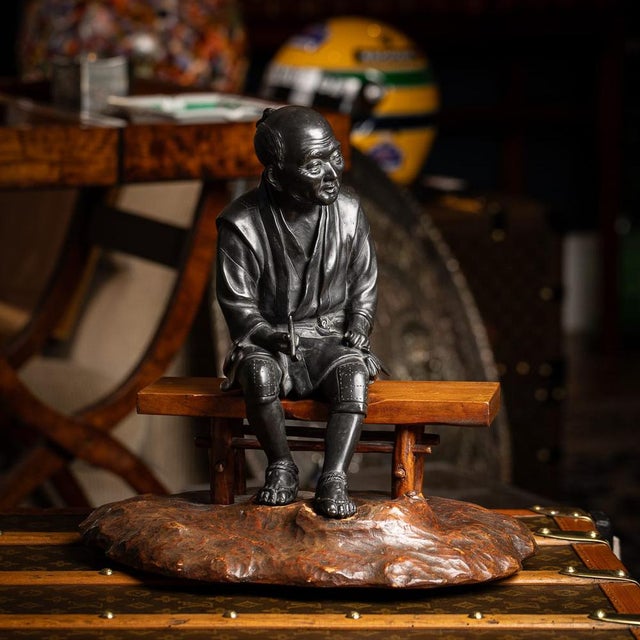 Antique 19th Century Japanese Meiji period Takaakia bronze okimono. The elderly man is seated at rest on a removable...