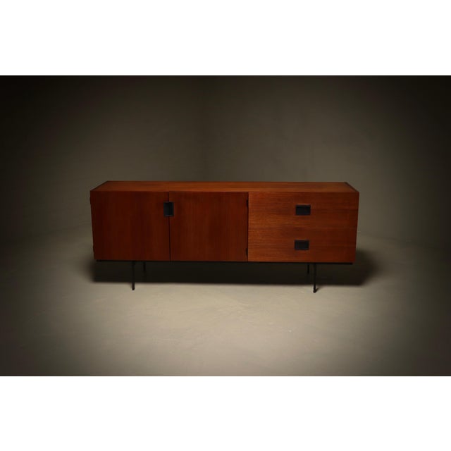 Iconic Pastoe model DU04 Japanese Series sideboard designed by Cees Braakman in 1958. The sideboard features two doors on...