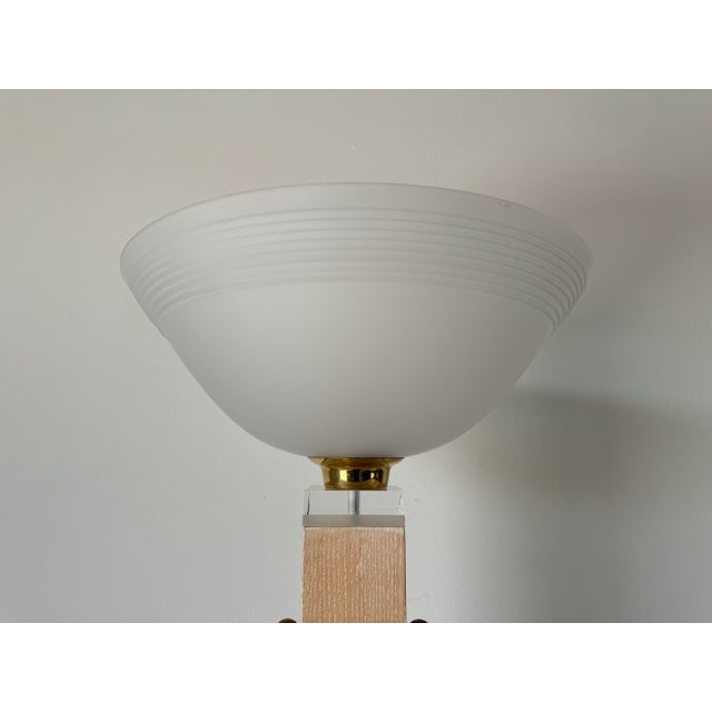 Amazing Postmodern Italian torchiere floor lamp. Features sculptural geometric cerused wood body, mounted on square Lucite...