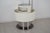 A floor-standing bar cabinet, an icon of 1970s Italian design, featuring a futuristic and functional line. The structure...