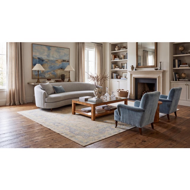 Elevate high-end interiors with this hand-knotted modern Oushak-style area rug. Crafted from premium wool, it features an...