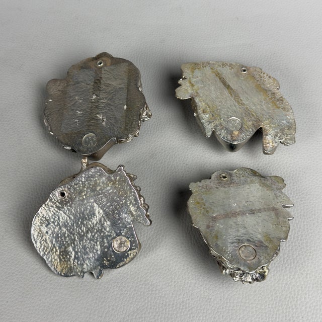 A splendid complete series of four small high-relief wall sculptures. This decorative set features a classic style,...