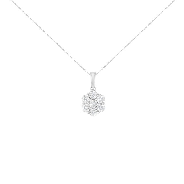 Chic and trendy, this elegant 14k white gold pendant has a floral design set with 7 round-cut, natural diamonds in a prong...