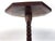 A classic antique mahogany plant stand featuring an octagonal top and a beautifully turned pedestal base rising to a...