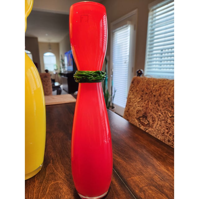 A striking collection of three hand-blown art glass vases from the prestigious B.A.G. (Barovier Art Glass) series. This...