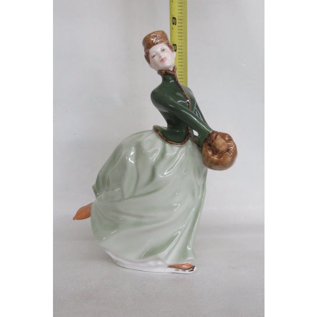 This gorgeous figurine is made of bone china / porcelain. This lovely collectible is stamped as having been made in...
