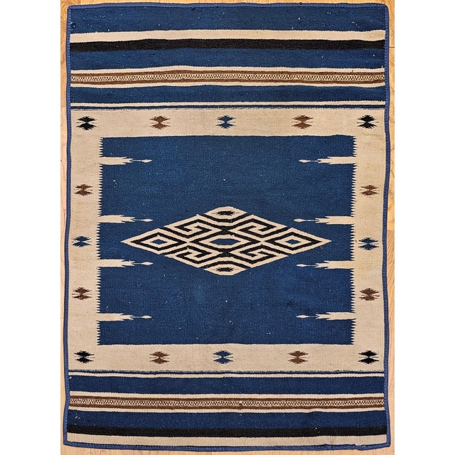 32” x 49” Vintage Mexican Saltillo Serape flat woven blanket circa the late 19th or the early 20th centuries. The...