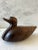 Vintage hand carved wood duck figure. Heavy weight and perfect for paperweight or shelf decor.
