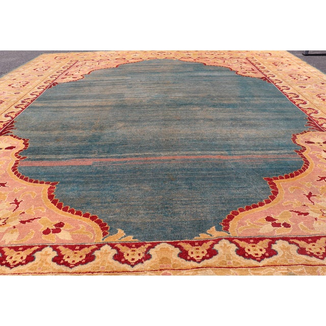 Indian Antique 19th Century Indian Agra Rug in Solid Blue Background For Sale - Image 3 of 14