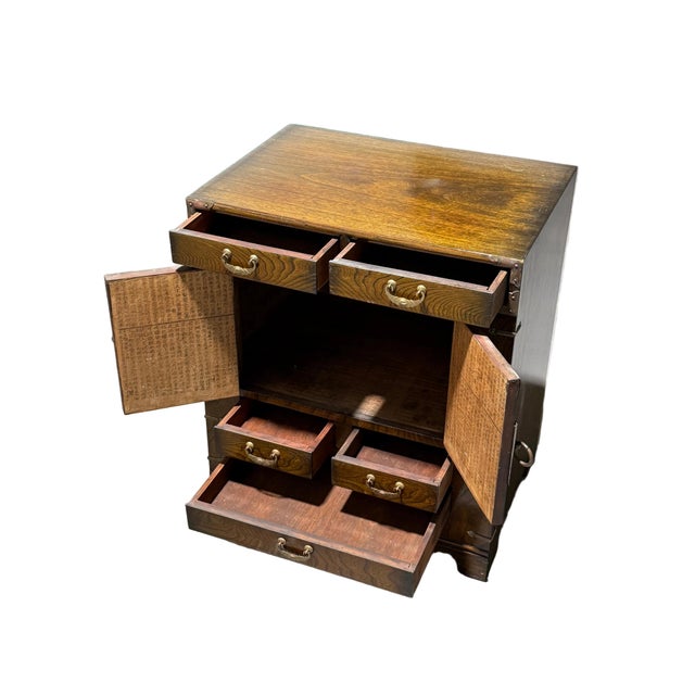 Gorgeous small Korean morijang chest, meant to be used as a bed side table. Incredible wood grain flowing from the lock to...