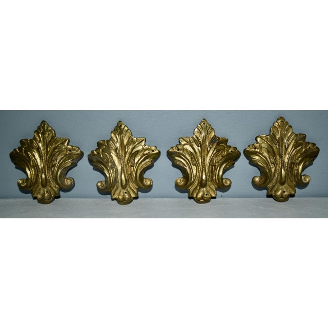 Vintage (1980's) Set of Four Brass Ormolu. Fleur-de-lis Style. Made in Italy. Burnished Gold Finish. The Measurements:...