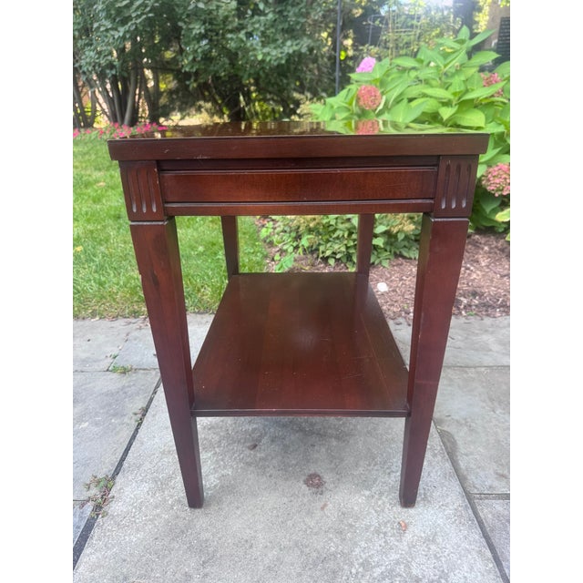 A classic mid-century occasional table from Mersman of Celina, Ohio, one of America's best-known makers of quality end and...