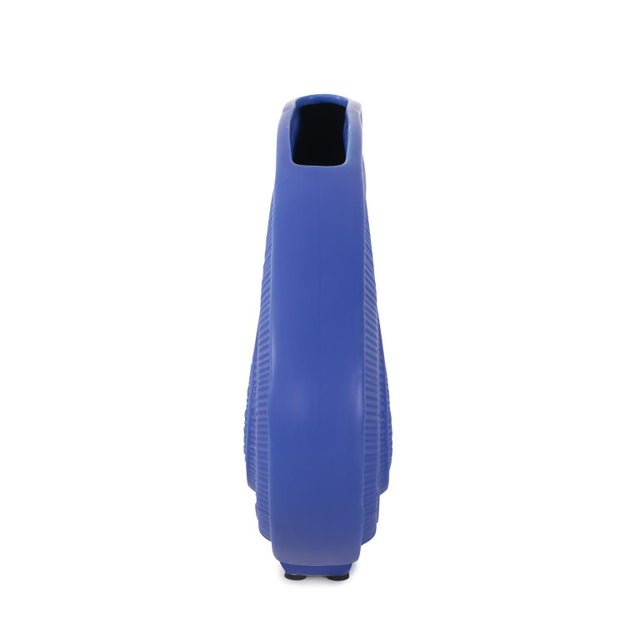 Elevate your decor with a striking fusion of form and color that adds a vibrant touch to any space. This versatile vase...