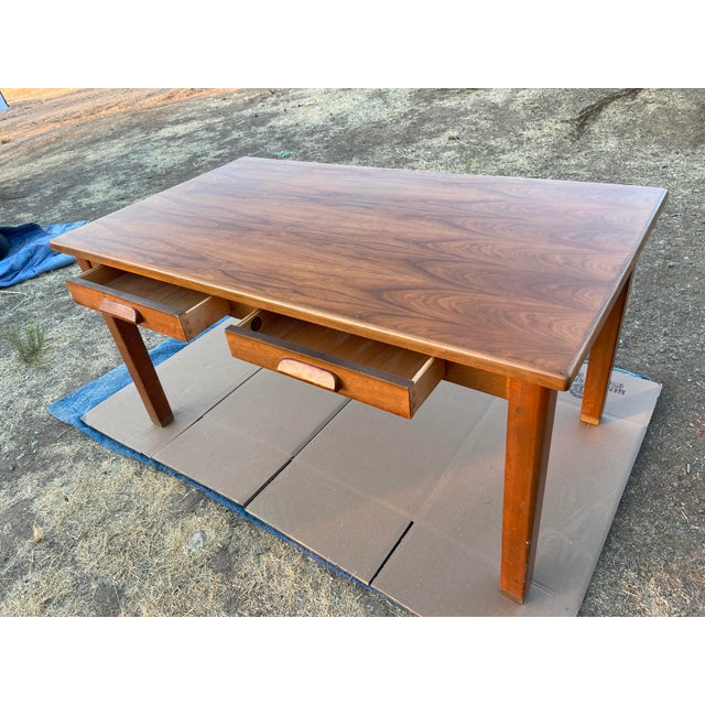 The Vintage Mid Century Modern Walnut Library Table by The Jasper Desk Company from 1959 is a stylish and functional piece...