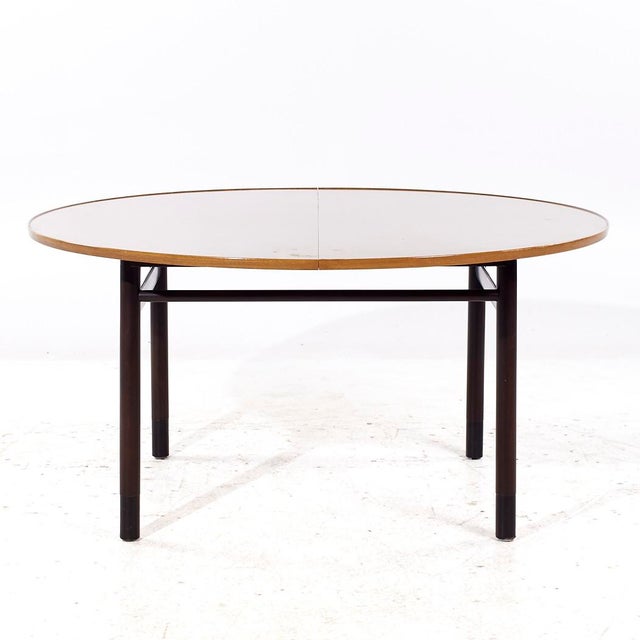 Edward Wormley for Dunbar Mid Century Mahogany Expanding Dining Table with 1 Leaf This table measures: 60.25 wide x 60.25...