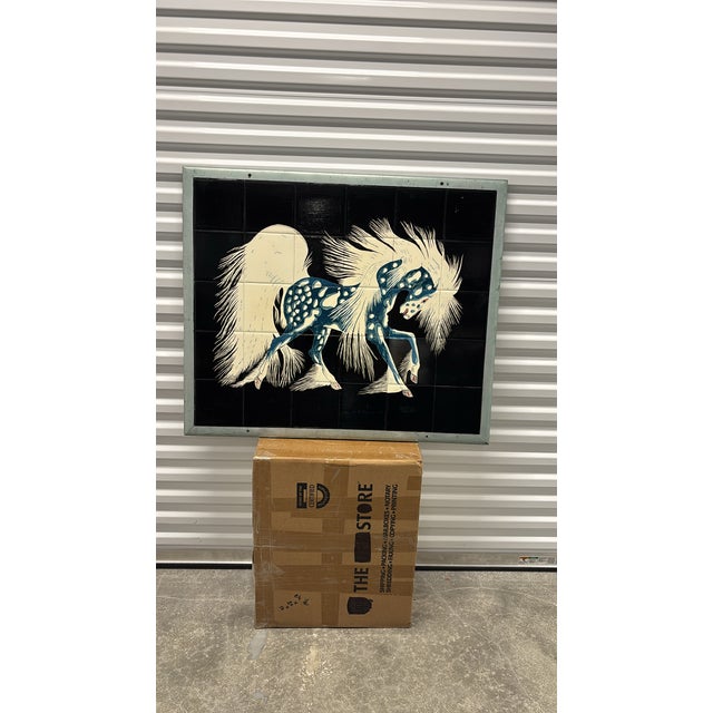 Artist: A.M.Henry (Potawatomi Nation)Subject: A stylized blue horse with a flowing white mane and tail from his iconic...