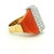 A bold 1970s cocktail ring crafted in 18K yellow gold, featuring two sculptural polished coral panels framing a dramatic...