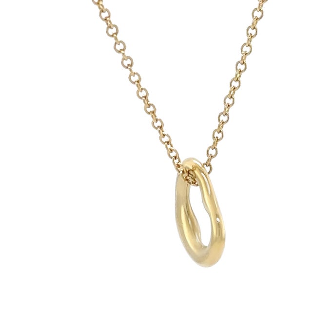 This delicate Tiffany & Co. Elsa Peretti pendant is crafted in 18ct yellow gold, featuring the iconic Open Heart design...