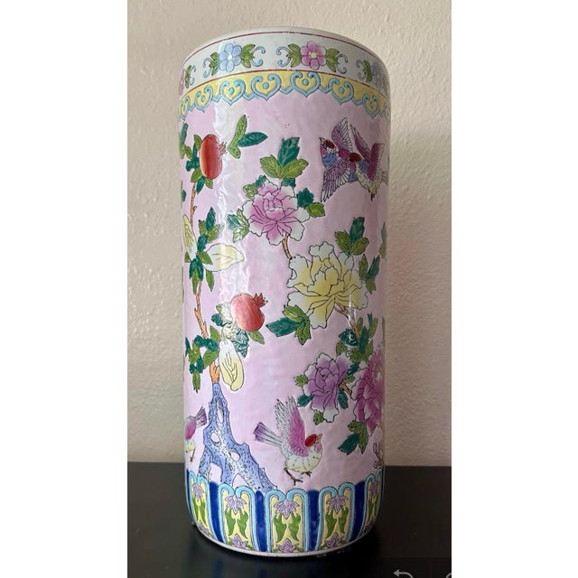 Make a statement with this stunning vintage Chinese Famille Rose porcelain umbrella stand, beautifully decorated in the...