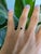 /A natural black diamond anchors this solid 14K yellow gold ring in a bold asscher cut, surrounded by twelve white earth-...