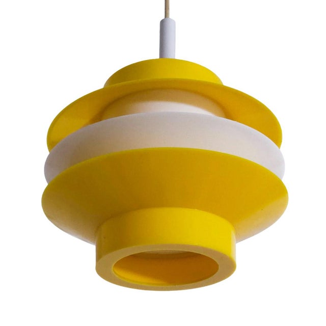 Mid-Century Modern Yellow White Pendant Lamp, Germany, 1970s, in Very Good conditions. Designed 1970 to 1979 Up to 250V...