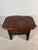 Charming small Spanish side table crafted in solid wood, featuring a carved drawer front with floral motifs and original...