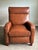 Handsome contemporary recliner lounge chair by Comfort Design upholstered in rich cognac brown leather. Featuring a clean-...