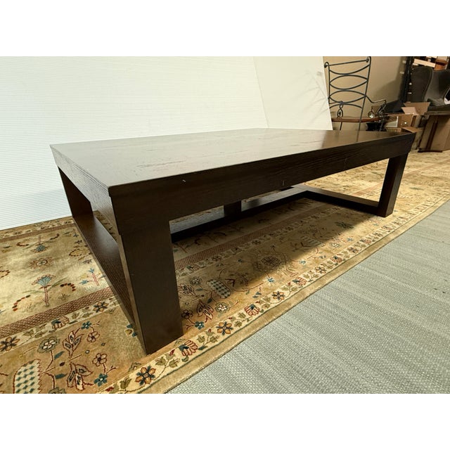 Design Plus Gallery presents the Dark Brown Cariton Coffee Table from Ashley Furniture. Showing off big-time with...
