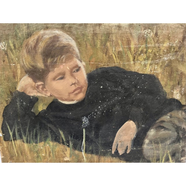 Vintage portrait of a young boy relaxing in a field sprinkled with dandelions. You can feel the breeze blowing as...