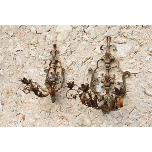 Pair of Early 20th Century Wrought Iron Three Light Sconces with Metal Acanthus Leaves and Fleur de Lis. Ready for use...