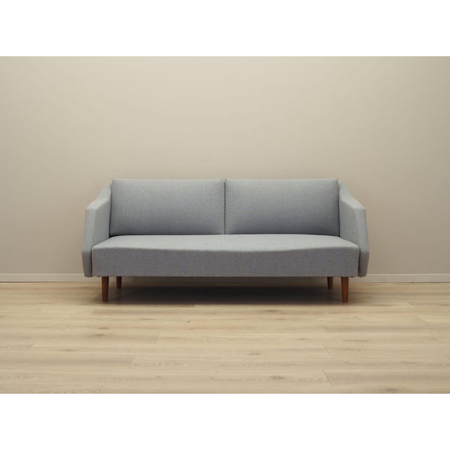 The sofa was made in the 1960s, Danish production. Furniture structure made of solid pine wood. Legs made of solid beech...