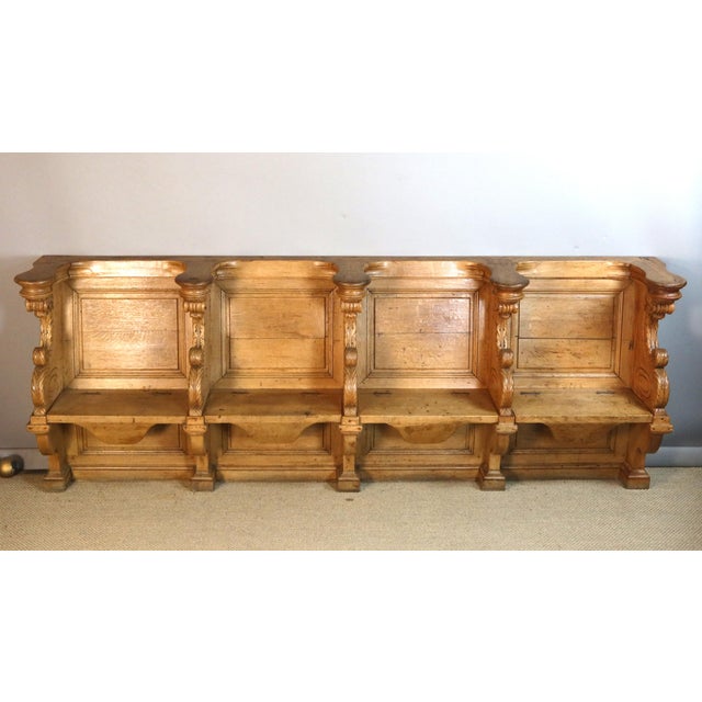 Late 18th-century carved light oak church stalls. These stalls include four removable seats. The carvings are of very high...