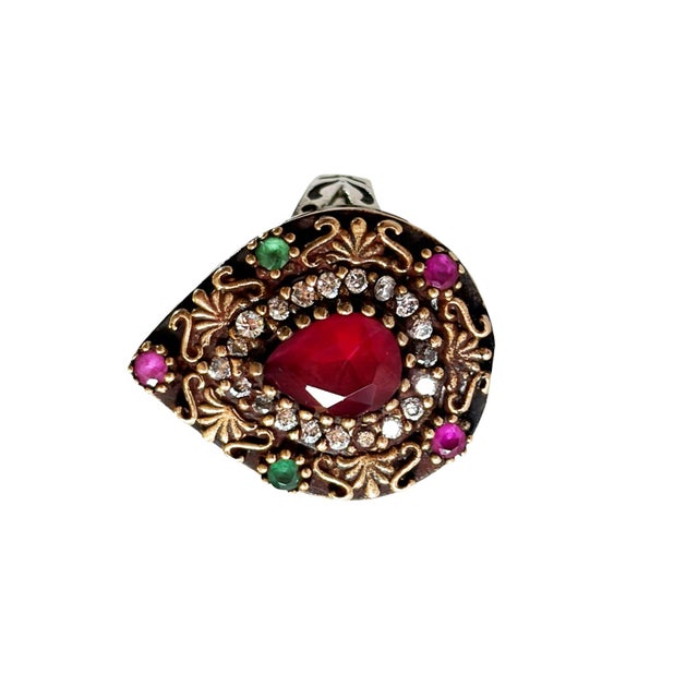 This fabulous vintage hand-made sterling silver statement ring from Jaipur, India features ruby, emerald, and sparkling...