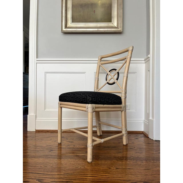 Set of four rattan side chairs or dining chairs designed by breakthrough innovator Elinor McGuire in the California...