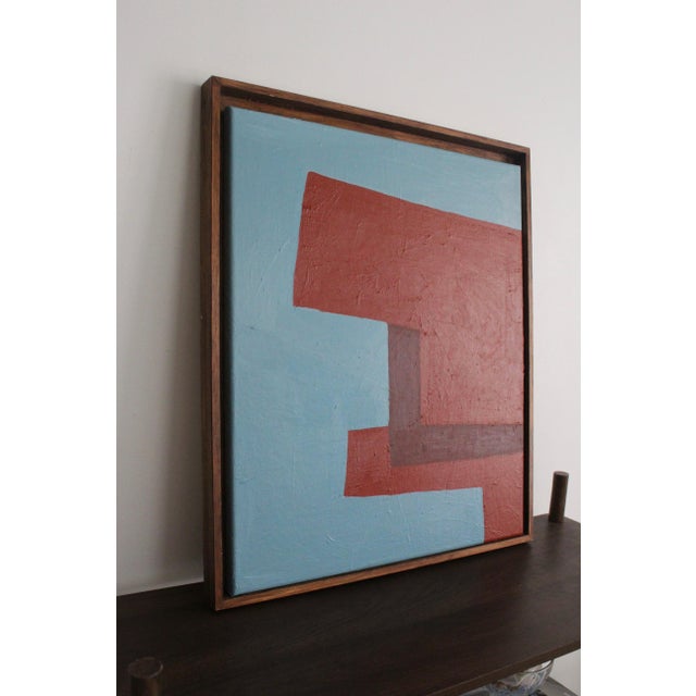 Structure in Red and Blue explores the interplay between balance and contrast through a minimalist geometric composition....