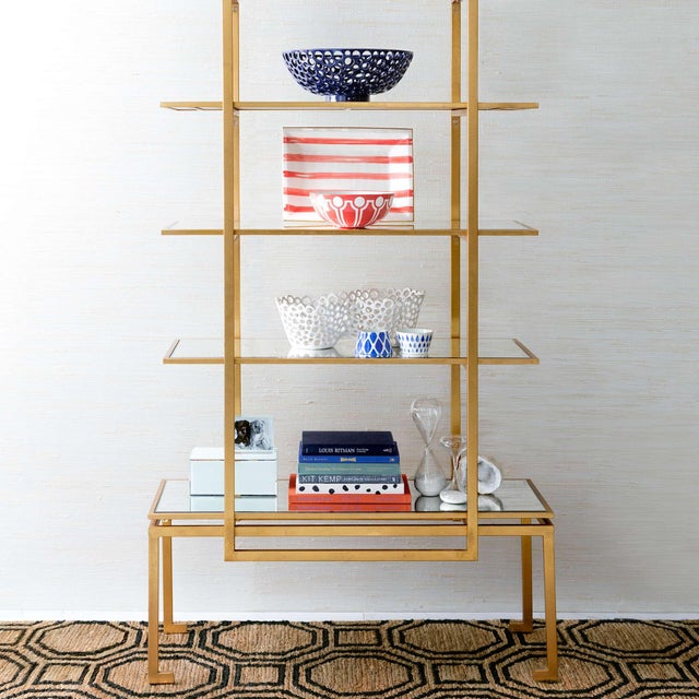 Interlocking inky tiles create soothing symmetrical shapes on a natural backdrop. Hardworking undyed jute is hand knotted...