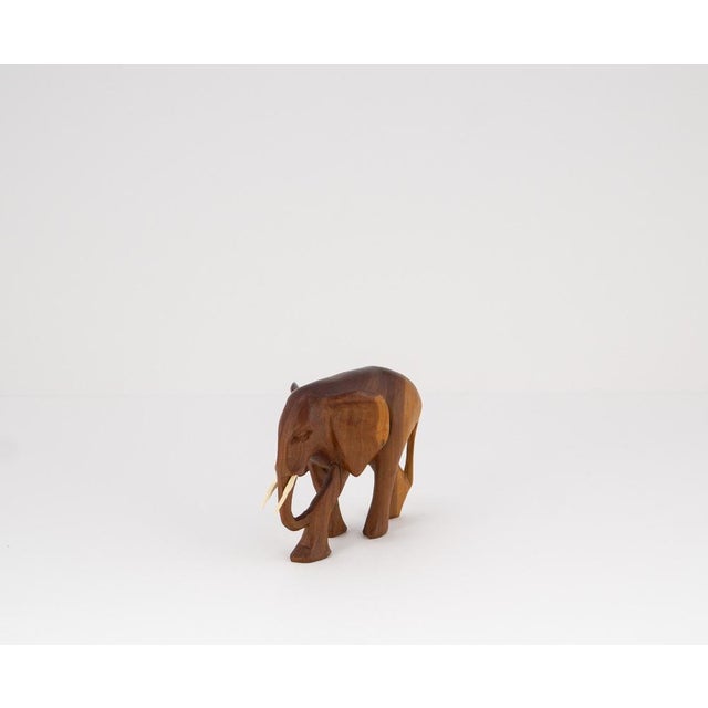 A charming example of 1960s sculptural craftsmanship, this compact elephant figure captivates with its flowing lines and...