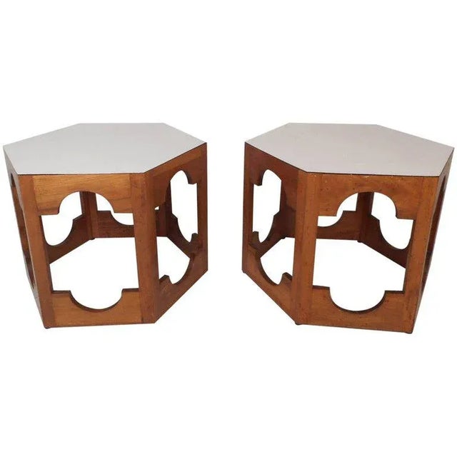 This beautiful pair of vintage modern end tables feature a white laminate top and a walnut base. Sleek design with unusual...