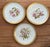 A matched set of ten antique French Limoges porcelain cabinet plates, each individually hand-painted with a different...