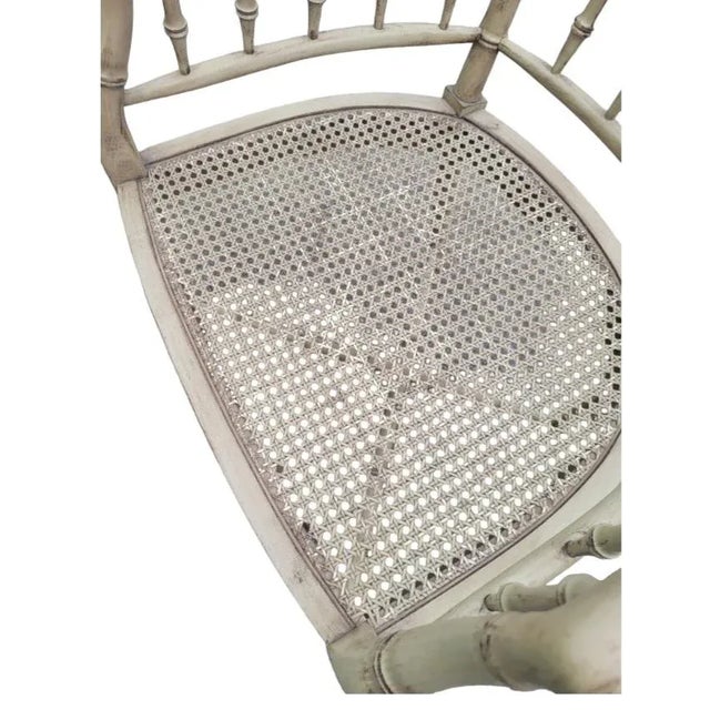 A wonderful vintage faux bamboo cane seat Regency side chair. The chair has a beige or very creamy light tan finish with...