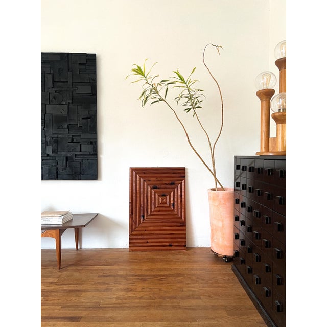Handcrafted in the 1970s and sourced from a Southern California estate, this sculptural wood wall panel showcases a bold...